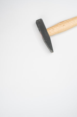 A machinist hammer with a wooden handle isolated on a white background- free space for textの写真素材