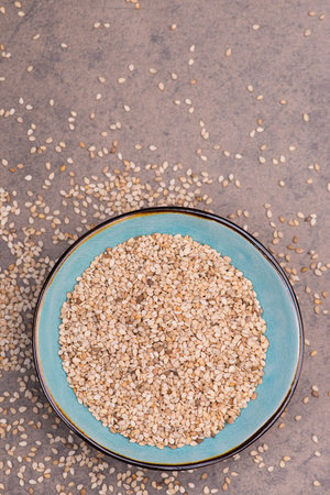Sesame seeds on a textured background, healthy food, vegan  fiber