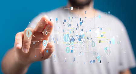 A finger touching a digital illustration of binary codeの写真素材