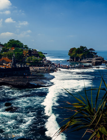 A vertical shot of scenic seascape view and beautiful waves overflow the coast, Indonesiaの写真素材