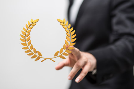 A businessman presenting a 3D render of golden prize symbolの写真素材