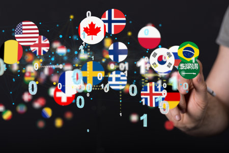 A person presenting the virtual projection of the flags of different countriesの写真素材