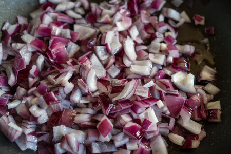 A top view of sliced onions frying on the panの写真素材