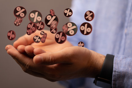 A person presenting the virtual projection of sale or discount concept through the percent symbolsの写真素材