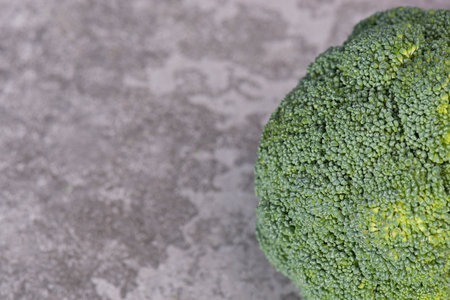 Broccoli on a grey structured background, egan food, healthy vegetablesの写真素材