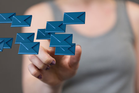 A hand touching message icons - the concept of networkingの写真素材