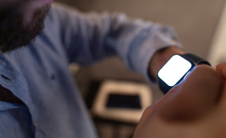 A closeup shot of a smartwatch on a person's wrist with a blank screenの写真素材