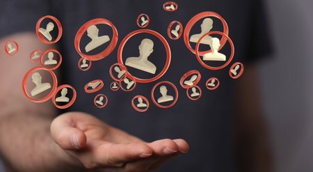 A businessman holding the virtual 3D network icon symbolizing cooperation and teamworkの写真素材