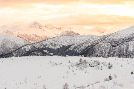 The winter landscape near Dinglavatnet lake. Beautiful sunset over mountains. Volda, Norway.