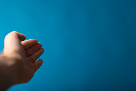 A male outstretched hand with an open palmの写真素材