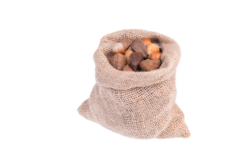 Mix of nuts and try fruits isolated on a white backdrop, raisons, almonds, nutsの写真素材