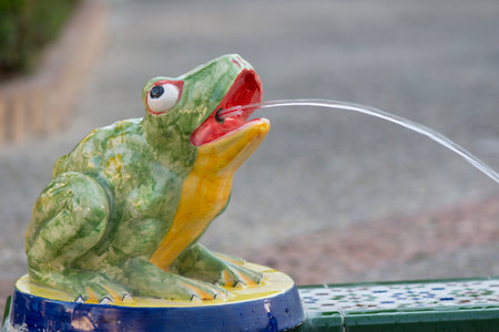 A glazed ceramic frog in a fountain, Plaza de Santa Maria, Tarifa, Andalusia, Spainの写真素材