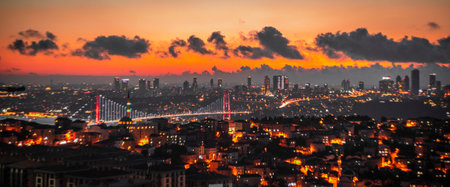 A panoramic shot of Istanbul covered in lights in the evening in Turkeyの写真素材