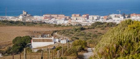 A panoramic shot over Tarifa, white village, seen from the natural park near the strait, Cadiz, Andalusia, Southern Spainの写真素材