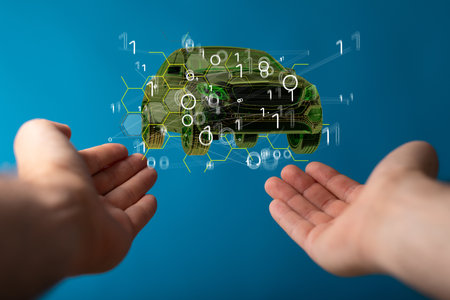 Floating 3D electric car icon (autonomous driving) above a male's handsの写真素材