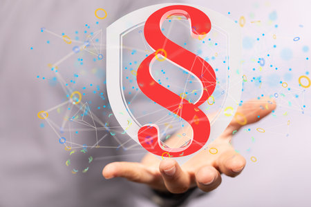 A man holding the virtual symbol of law and justice in 3Dの写真素材