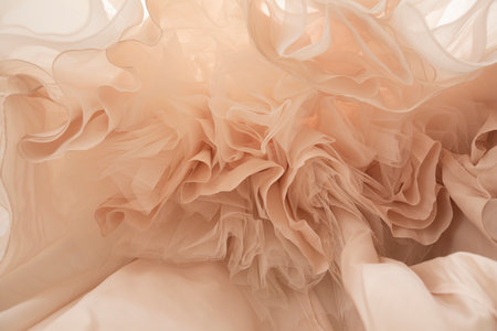 A closeup shot of white organza on a wedding dress
