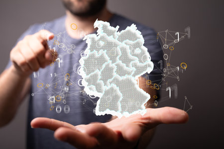 A person presenting the virtual projection of the hologram of Germany mapの写真素材