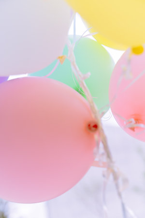 A vertical shot of colorful balloonsの写真素材