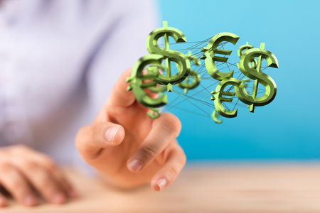 A businesswoman holding different virtual 3D currency symbolsの写真素材