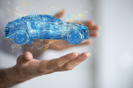 A man holding the 3D rendering of an autonomous electric carの写真素材