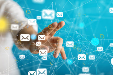 A finger touchinnetwork communications concept with floating letter signs on the handの写真素材
