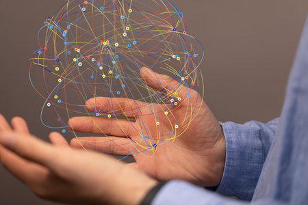 A male's hands holding an illustration of the concept of teamwork and partnershipの写真素材