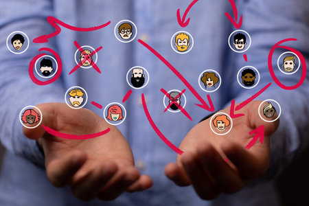 Colorful people icons in the network team hovering over a man's handの写真素材