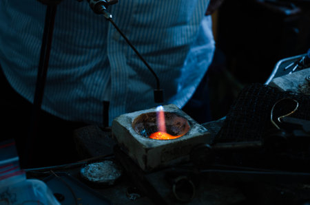 A closeup shot of fire flames burning in an ashtrayの写真素材