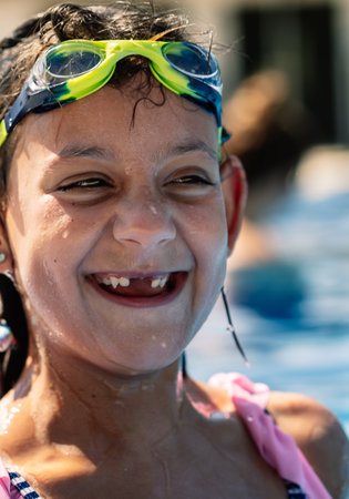 A closeup shot of a caucasian girl with a swimsuitの写真素材