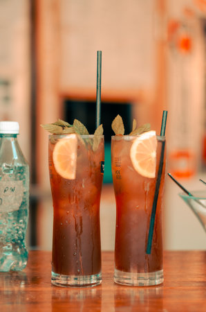 A vertical shot of glasses of mojito juice on a tableの写真素材