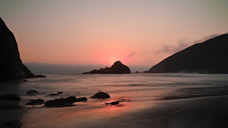 A beautiful view of the rocky cliffs on the Pfeiffer Beach in California, USAの写真素材