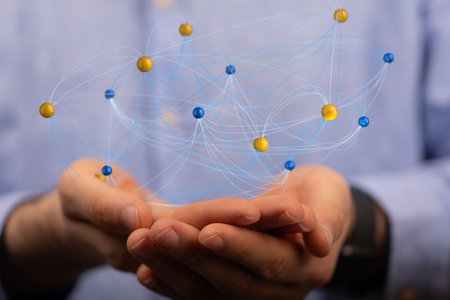 A male's hands holding an illustration of the concept of teamwork and partnershipの写真素材