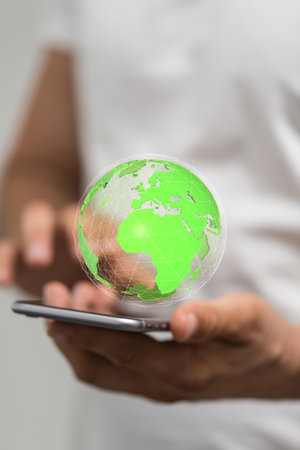 A person presenting a 3D render of the globeの写真素材