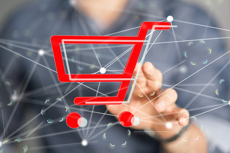 A closeup of a man touching an illustration of a cart - online shopping conceptの写真素材