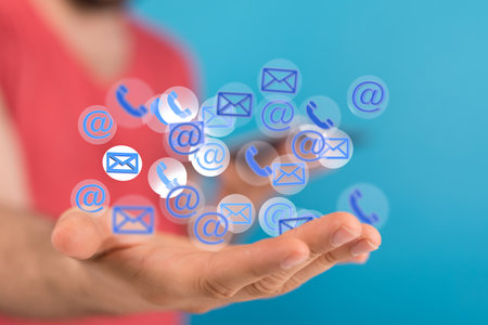 A 3D rendering of virtual logos hovering over a person's handの写真素材