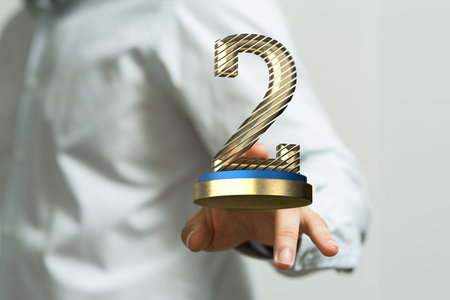 the male hands with 3d rendered winner second place ceremony awardの写真素材