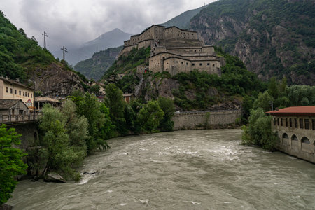 A beautiful view of Fort of Bard in Aosta Valley, Italy on a cloudy dayの写真素材