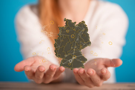 A 3d render of a German flag and female hands on a blurry backgroundの写真素材