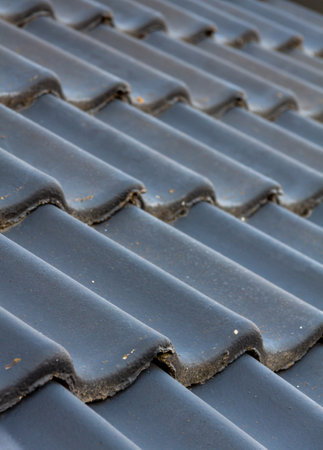 A selective closeup of gray roof tilesの写真素材