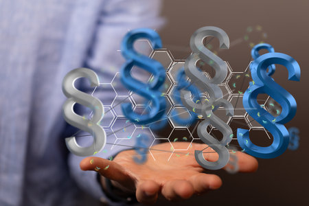 A closeup of 3D rendered paragraph section sign hovering in a man's handの写真素材