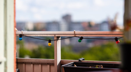 The small colorful light hanging at the balconyの写真素材