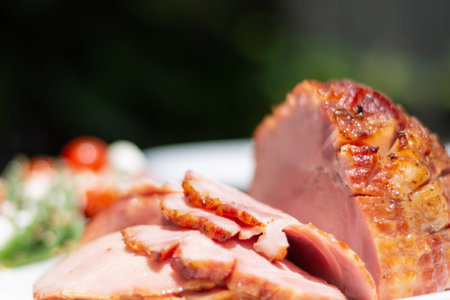 A closeup shot of sliced ham on a plateの写真素材