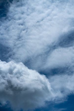A low-angle shot of the cloudy skyの写真素材