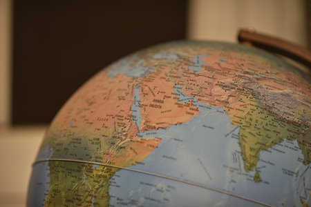 A closeup shot of a globe on a blurred backgroundの写真素材