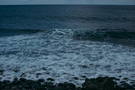 A beautiful view of splashing stormy sea waves on a rainy dayの写真素材