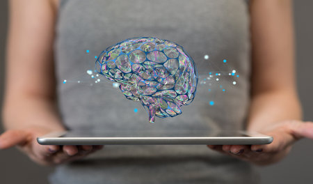 A 3d rendering of a digital human brain concept over a tablet in woman's handsの写真素材