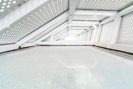 A futuristic style steel architecture with empty ground floor for car and other products displayの写真素材