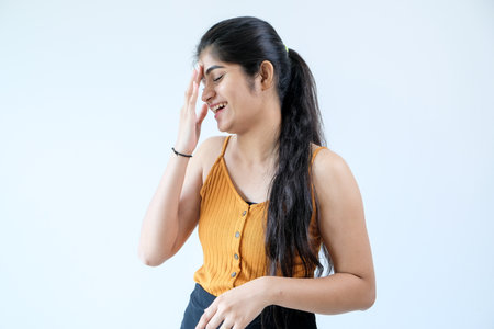 A closeup of a girl laughing awkwardly.の写真素材