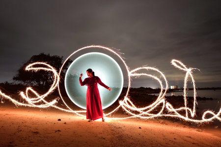 An Indonesian female in a red dress dancing in the background of 2021 spinning lights